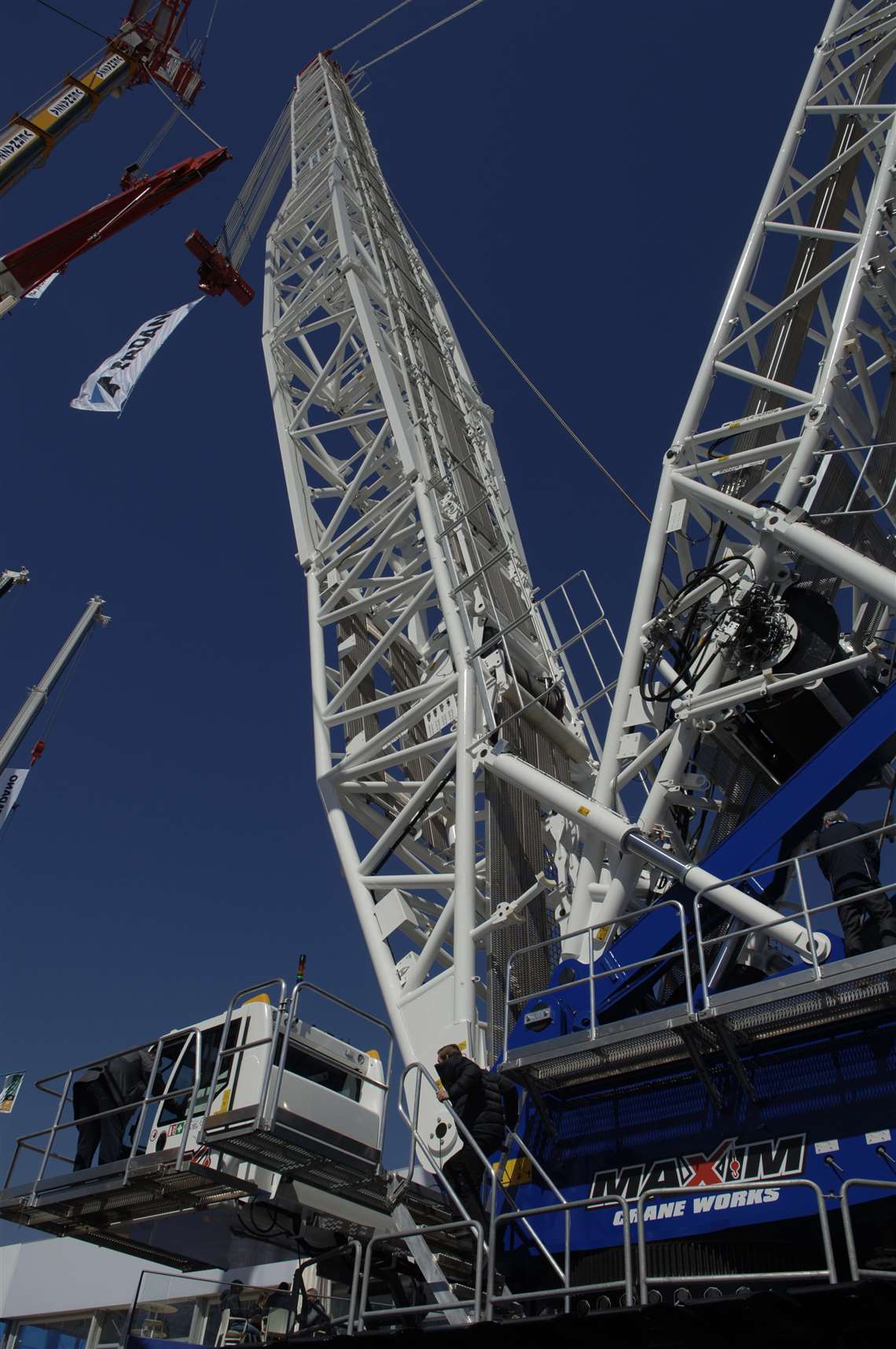 big blue and white Tadano crawler crane at Bauma 2025