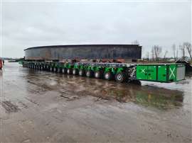 Column of SPMT in NXGEN green livery carrying a large steel fabrication