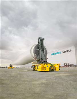 yellow Combilift Combi-LC load carrier with a turbine blade