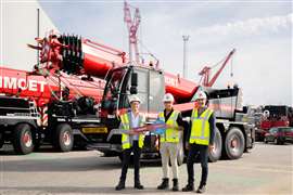 Handing over the new Liebherr LTC 1050-3.1E to Mammoet at its yard in the Netherlands