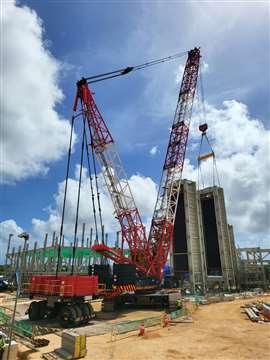 red and white Denza HSC 6000SLX crawler crane at work in Guam