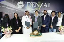 Denzai and FTE Logistics people lined up at signing ceremony