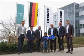 Line up of Liebherr people and the CEO at AMHEC