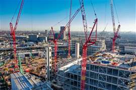 Five red Wolff luffing jib tower cranes building a data centre in London