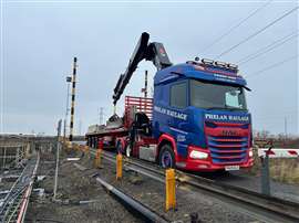 Blue and red Daf tractor with big Hiab crane behind the cab