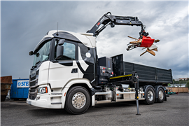 black Hiab HiPro hybrid loader crane mounted behind the cab