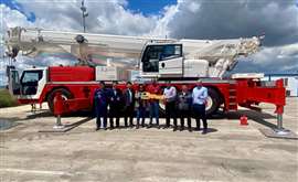 red and white XCMG XCA120 E all terrain crane handover