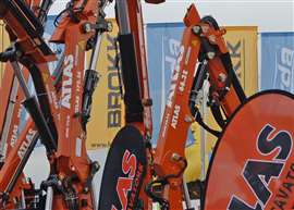 Orange Atlas cranes on display at the Bauma trade show in Munich