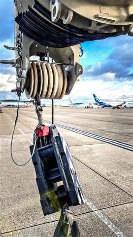 Planes on the runway seen behind the crane's hook. (Photo: Manitowoc)