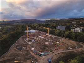 The first two of four new Jaso J390 low top tower cranes being erected in Cardiff, Wales, by Falcon Tower Crane Services. Photo: Falcon Tower Cranes