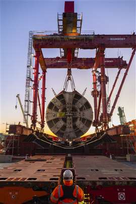 Mammoet lowering one of the head sections of the TBMs onto the saddles on the SPMT prior to transport to another area of the site for further dismantling