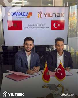 Mohamed Moufid, Somalev CEO, left, and Ömer Gece, Yilnak managing director, signing the memorandum of understanding between the two transport specialist operators.