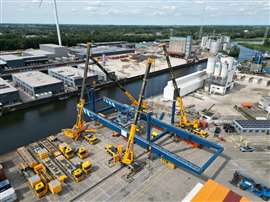 Van Riel's foursome prepares to lift the refurbished gantry crane