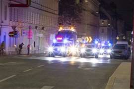 The convoy crossing one of several inner-city intersections at night