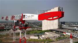 Red and white flat top Potain tower crane on the MIND project