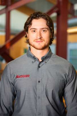 person in a grey shirt: Colton Rhew at Buckner Heavylift Cranes