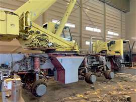 Grove all terrain, wheels off, in a manitowoc EnCore workshop undergoing refurbishment