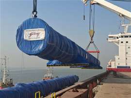 big long blue process column being lifted by a ship's crane