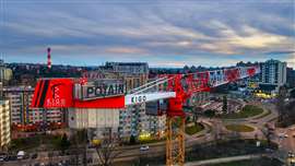 A Potain topless crane works at dusk in Belgrade, Serbia. Photo: Manitowoc