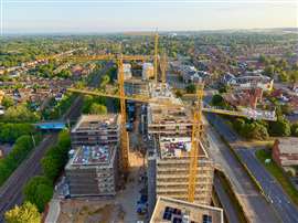 Aerial view of four of Falcon's yellow Jaso tower cranes on site