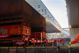 Mammoet crew members work from a barge at Amsterdam Centraal Station. Photo: Mammoet