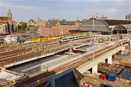 The newly installed bridge section at Amsterdam Centraal Station, with the historic station building and rail platforms in the background. Photo: Mammoet