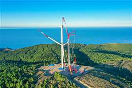 big crawler crane erecting a wind turbine