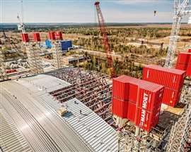 Mammoet on the Chernobyl nuclear disaster site in Kyiv Oblast, Ukraine. The company was asked to aid in the construction and installation of the new arch-shaped safe confinement, the largest land-based movable structure ever built. It was Mammoet’s task to lift, skid and install the 36,200-ton shelter from its construction site to its destination for the next hundred years. Photo: Mammoet