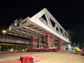 imposing sight of the bridge supported on SPMT with towers made from MSG mast sections to give the height