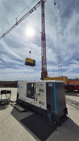 Atlas Copco power unit and a self erecting tower crane