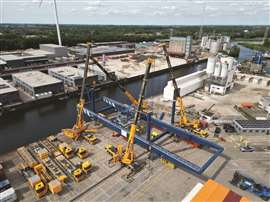 Van Riel used four large wheeled mobile cranes to install a 240 tonne port gantry crane