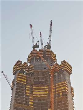 A trio of Favelle Favco luffing jib tower cranes building the world's tallest tower