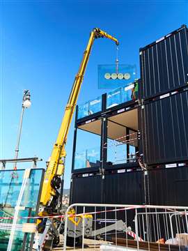 Jekko SPX532.2 with vacuum lifter moving glass panels at Barcolana