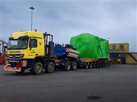 Mercedes Actros tractor and ten axle PST trailer in Vanguard's yellow livery