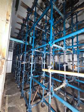 blue scaffold structure supporting the floor above