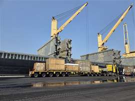 A ten axle trailer built with six- and four-axle modules coupled by a spacer section