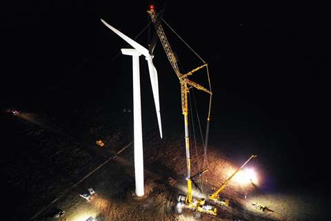 The 700 tonne capacity Liebherr LTM 1650-8.1 wheeled mobile telescopic crane constructing a wind turbine at night