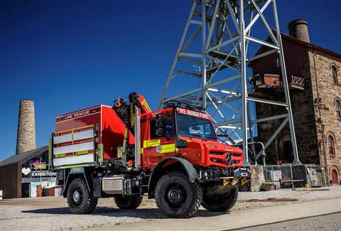 red truck with folded crane