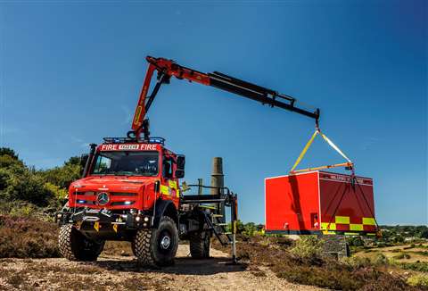 red truck with extended crane