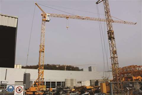 Two cranes on a construction site 