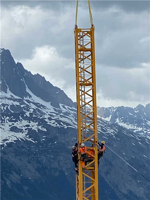 Engineers working at height to assemble the Potain MDT 109 crane