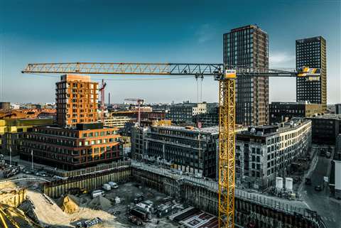 Liebherr's flat top 470 EC-B 20 tower crane on a city construction site.