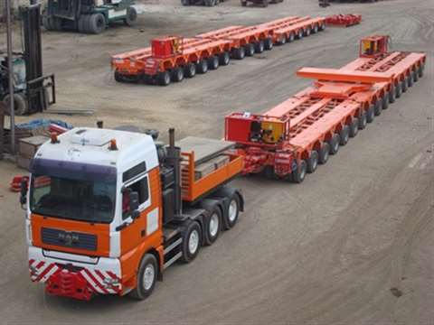 MAN tractor with Scheuerle trailer in orange and white colours of ETAL