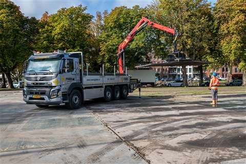 Volvo FMX truck with red Epsilon hydraulic crane both operated by one Drimote radio remote control