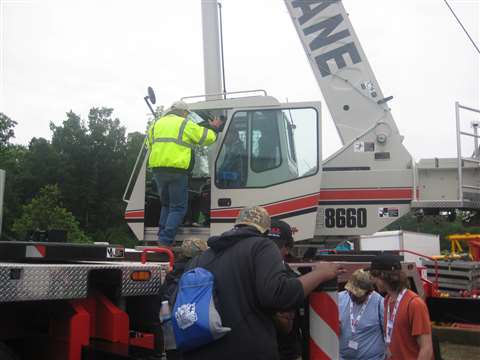 Rain didn't deter students' curiosity and desire to climb around on the cranes and hear about the ca