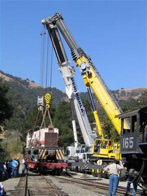 Peninsula Crane & Rigging uses its cranes to upright a derailed train.