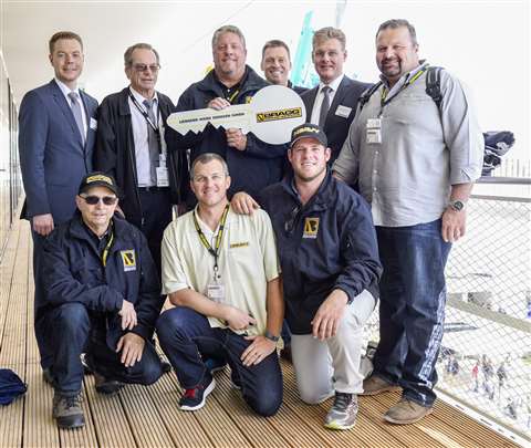 Bragg Crane Service's Scott Bragg participates in the handover of three cranes. Pictured, standing f
