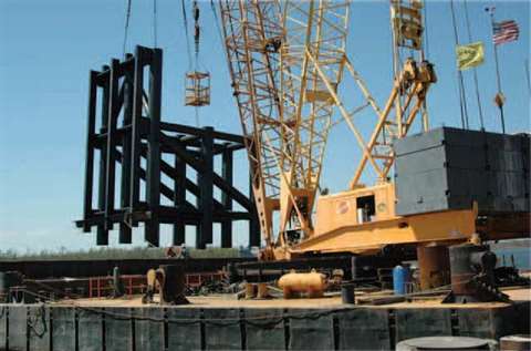 Several Manitowoc 4100 Ringer cranes have worked from barges repairing the damaged levee system in N