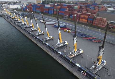 Aertssen Kranen used 14 Grove all terrain cranes lifting side by side to install a temporary pipelin