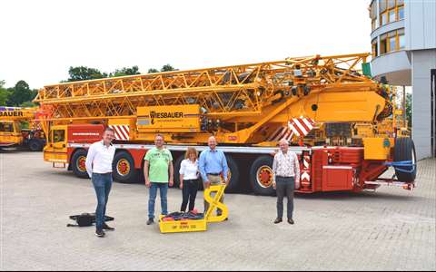 From left to right, Koos Spierings, Jochen Wiesbauer, Sabine Wiesbauer, Thomas Wiesbauer, Leo Spierings, all in front of the new Wiesbauer Spierings SK1265-AT6 Mighty Tiny
